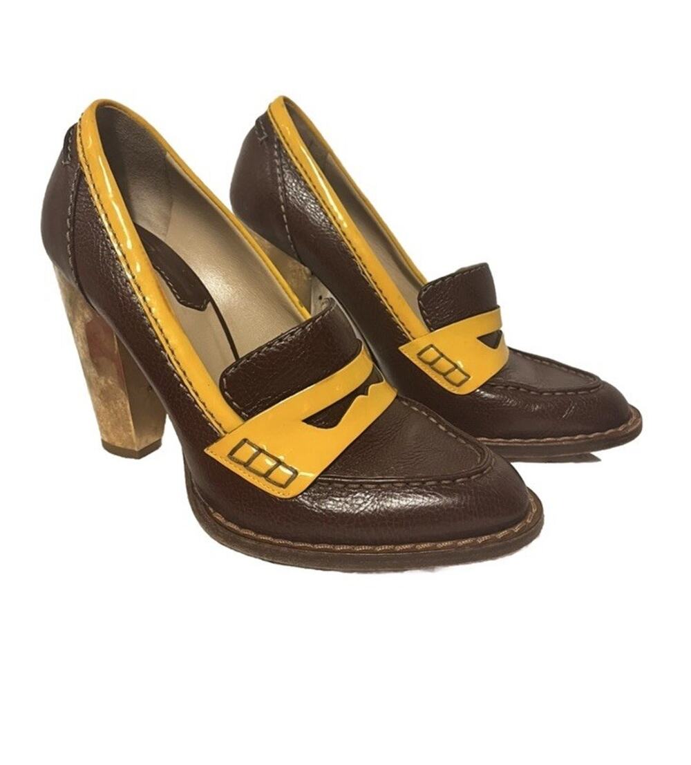 Dolce & Gabbana vintage two-tone penny loafer block heels 1970s retro aesthetic.